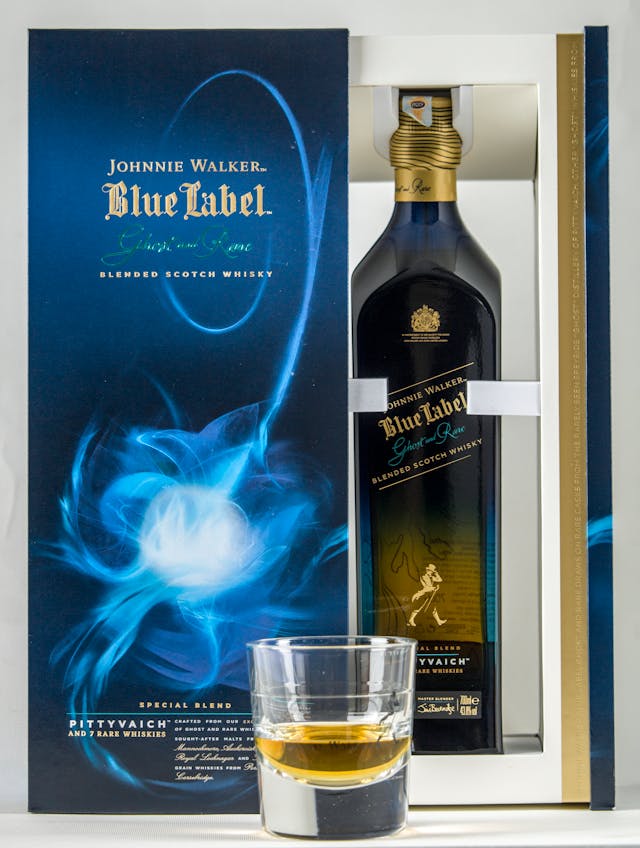 A bottle of Johnnie Walker Blue Label Ghost and Rare Blended Scotch Whisky in an elegant box with blue and gold accents.